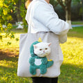Soft canvas pet shoulder bag with cartoon pattern, shown in Light Denim colour for carrying small dogs or cats.