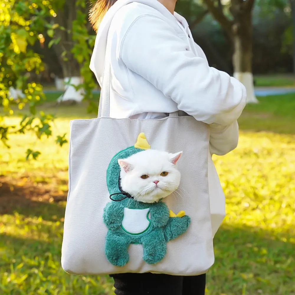 Soft canvas pet shoulder bag with cartoon pattern, shown in Light Denim colour for carrying small dogs or cats.