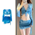 Women's blue four-piece bikini set with high-waist briefs, backless top, and coordinating skirt