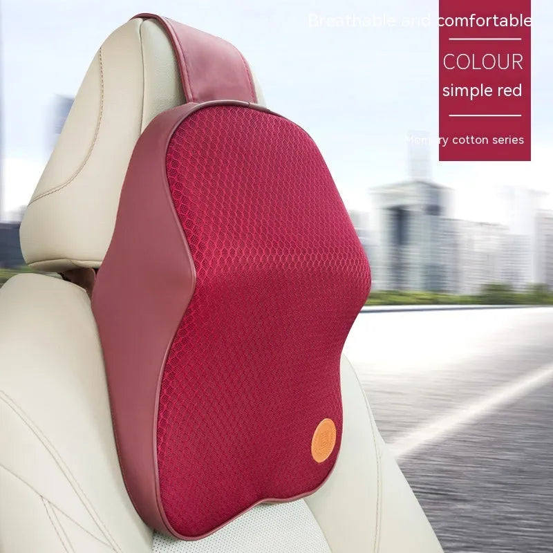 Black and brown memory foam car headrest and lumbar support pillows on a car seat.