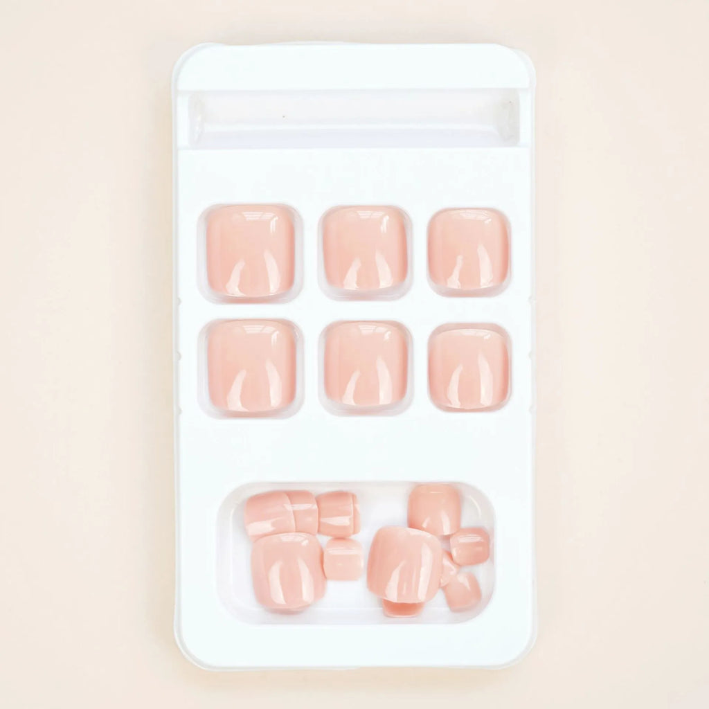 Fashion personality plastic toe nail stickers in skin colour with glue bottle for application.