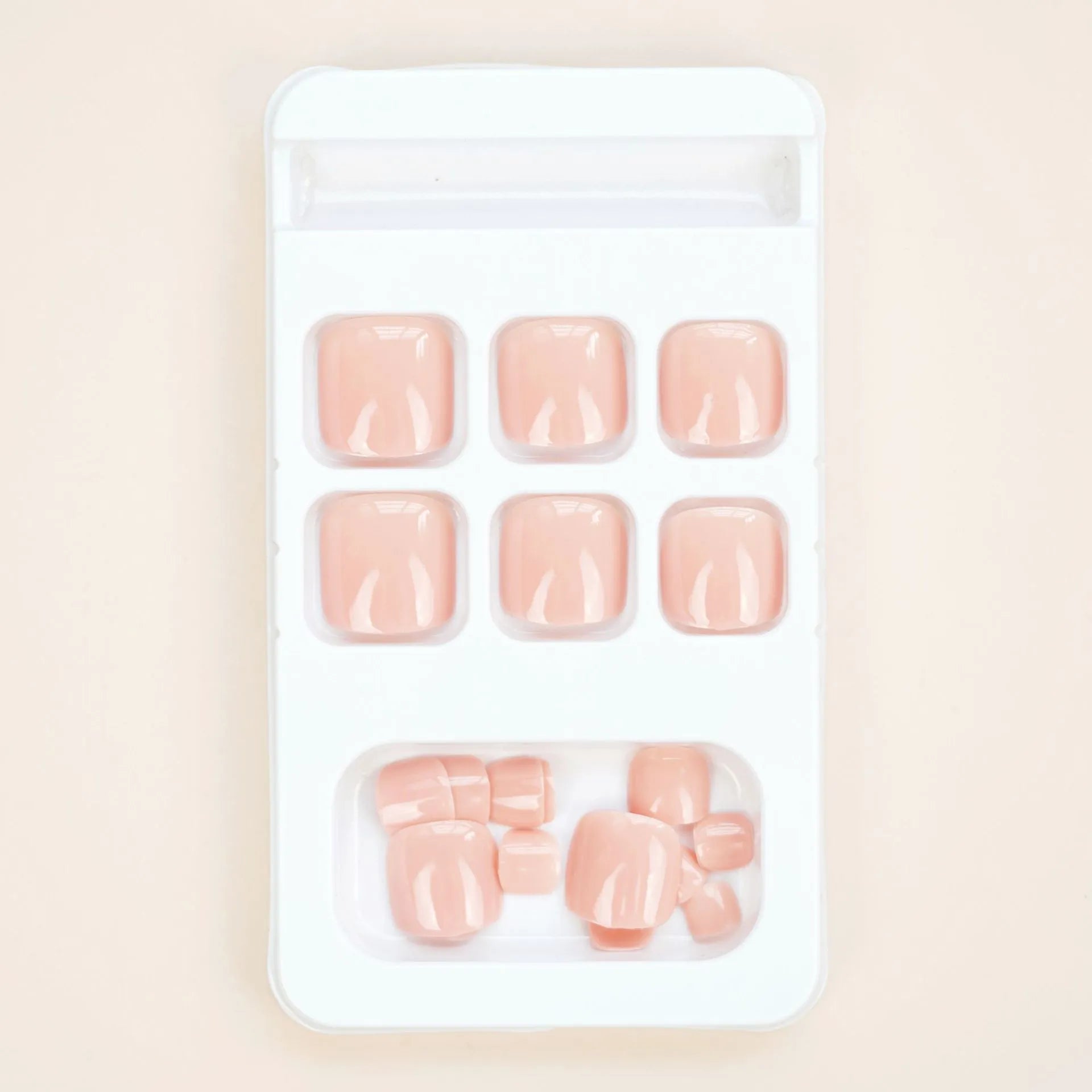 Fashion personality plastic toe nail stickers in skin colour with glue bottle for application.