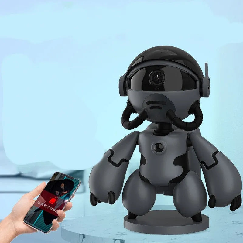 White or black wireless indoor security camera with a detachable base, shown on a shelf for home monitoring.