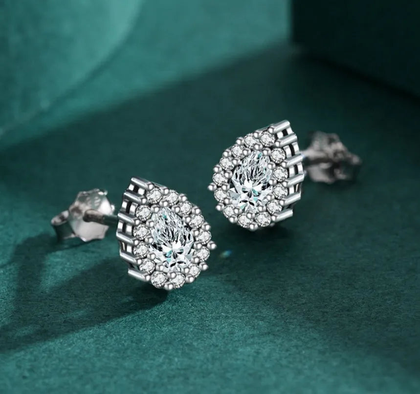 A pair of women's silver drop-shaped ear studs made from 925 sterling silver.