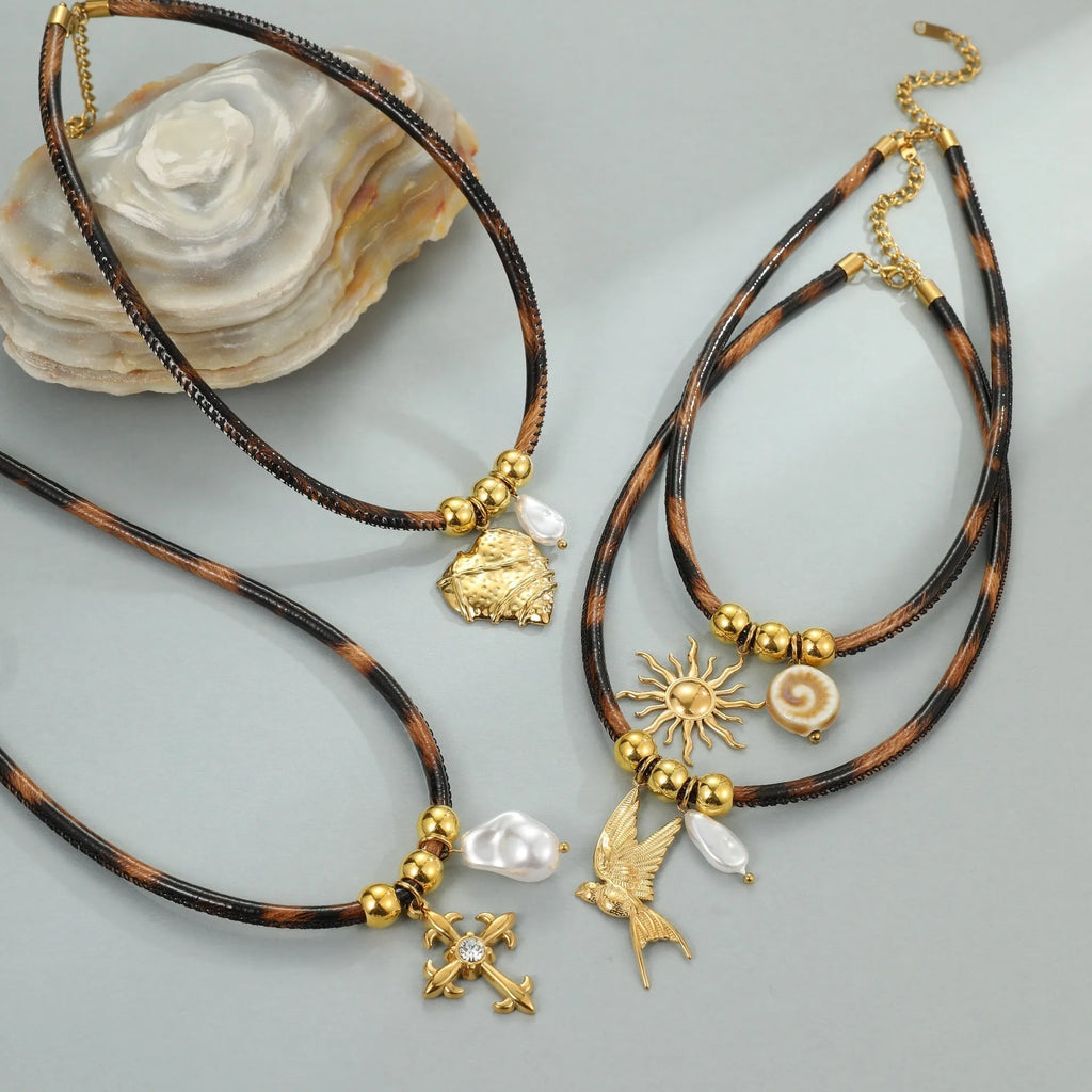 Geometric leopard print pendant on a stainless steel necklace chain with gold electroplated finish.