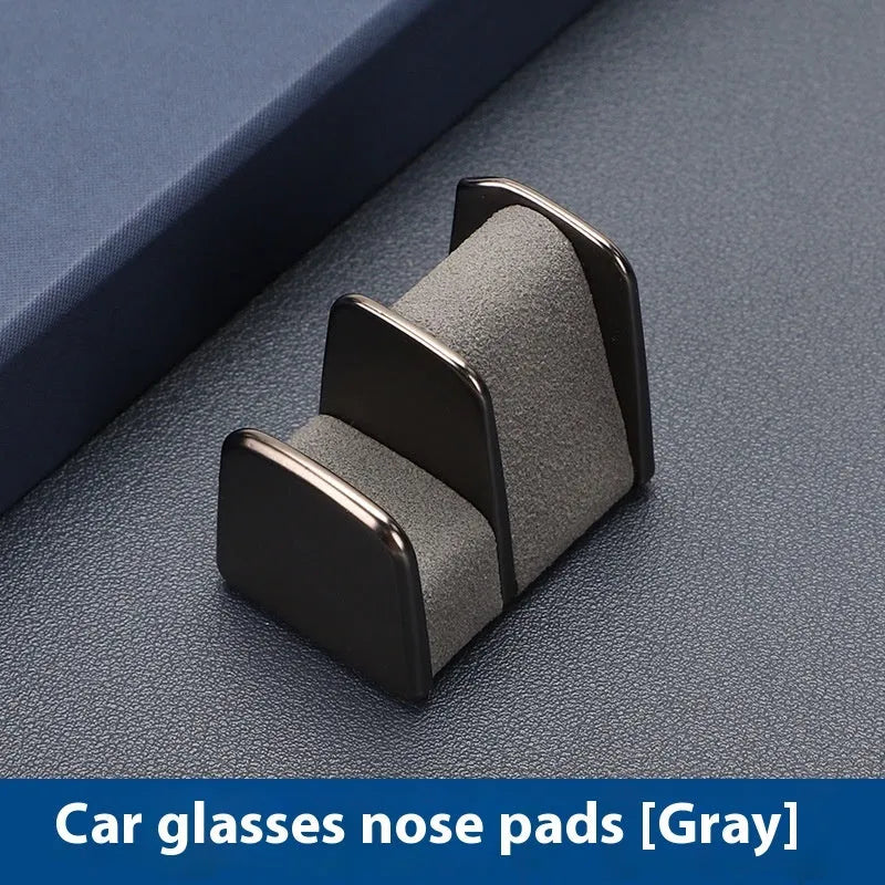 Car dashboard glasses holder clip in leather-covered zinc alloy, showing colour options