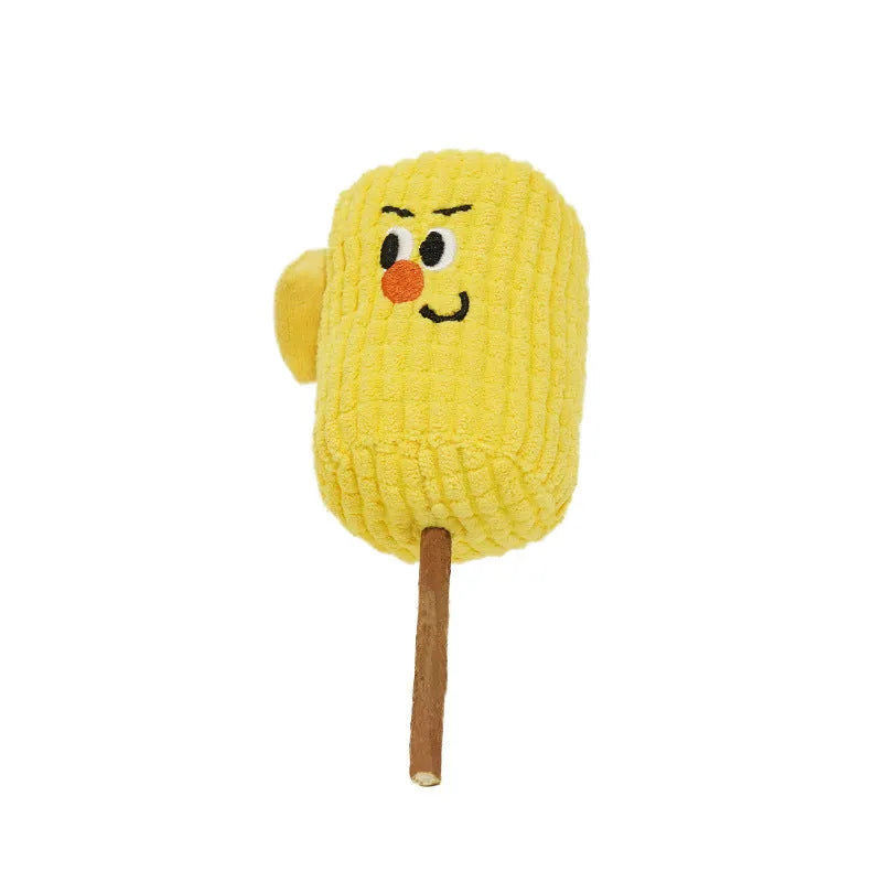 A corn cob shaped chew toy for cats made from polished beech wood, shown next to a tape measure indicating its 15cm length.