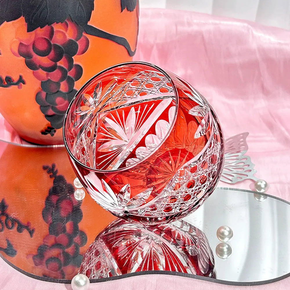 Crystal glass Jianghu Cut Zi Xinglu tumbler in violet with carved pattern on a bar surface
