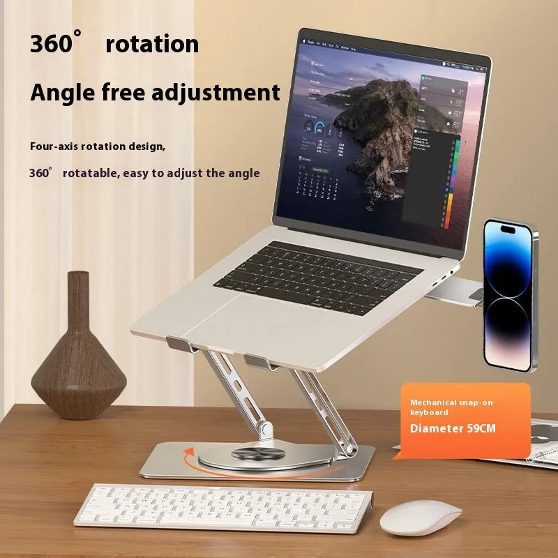 Silver carbon steel laptop stand on a desk, shown rotated with a phone attached to its magnetic holder.