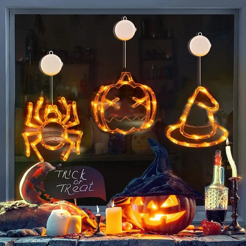 Seven Halloween LED lights with suction cups featuring spider, pumpkin and ghost designs for window decoration