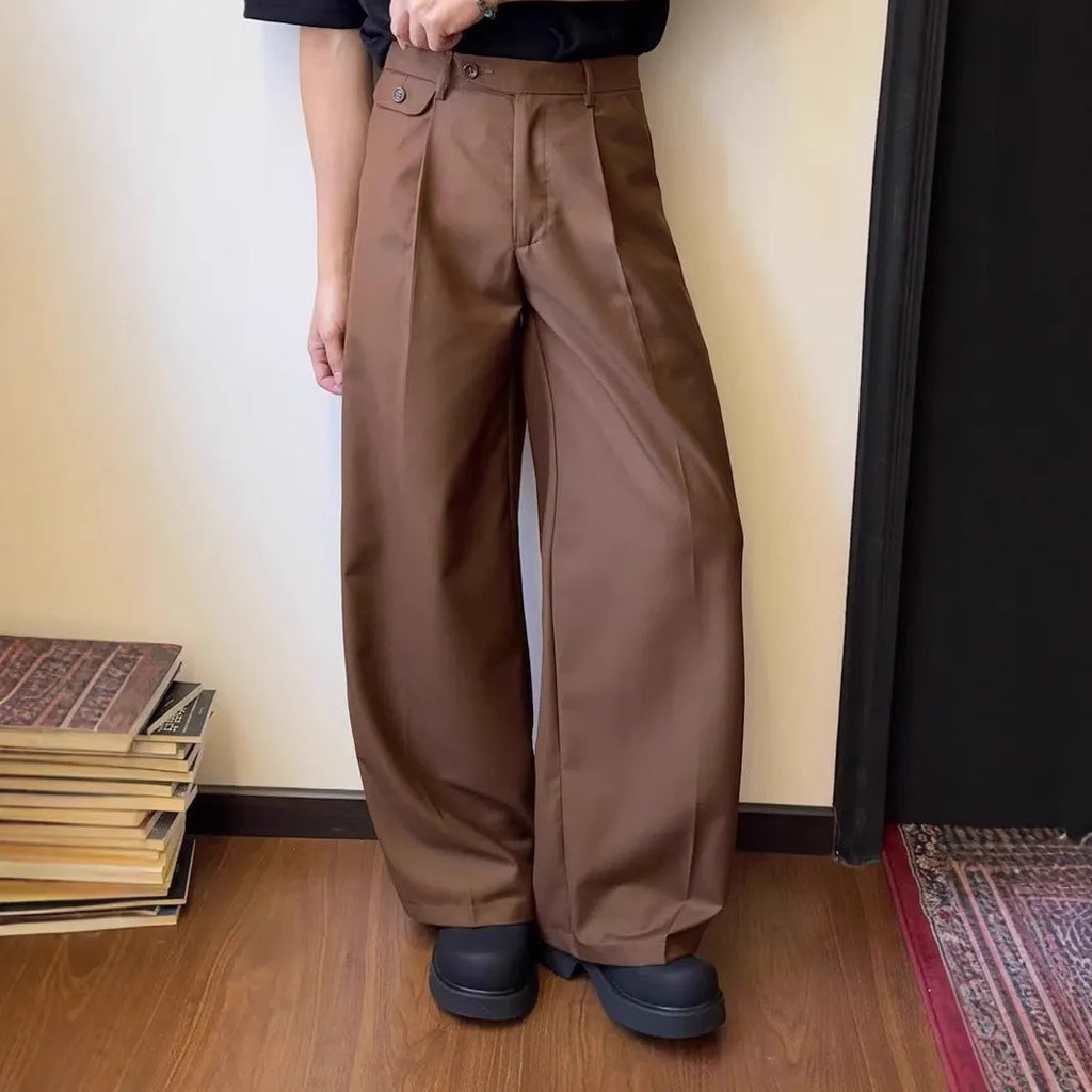 Men's straight-leg wide casual suit pants in brown solid colour, showing loose drape fit.
