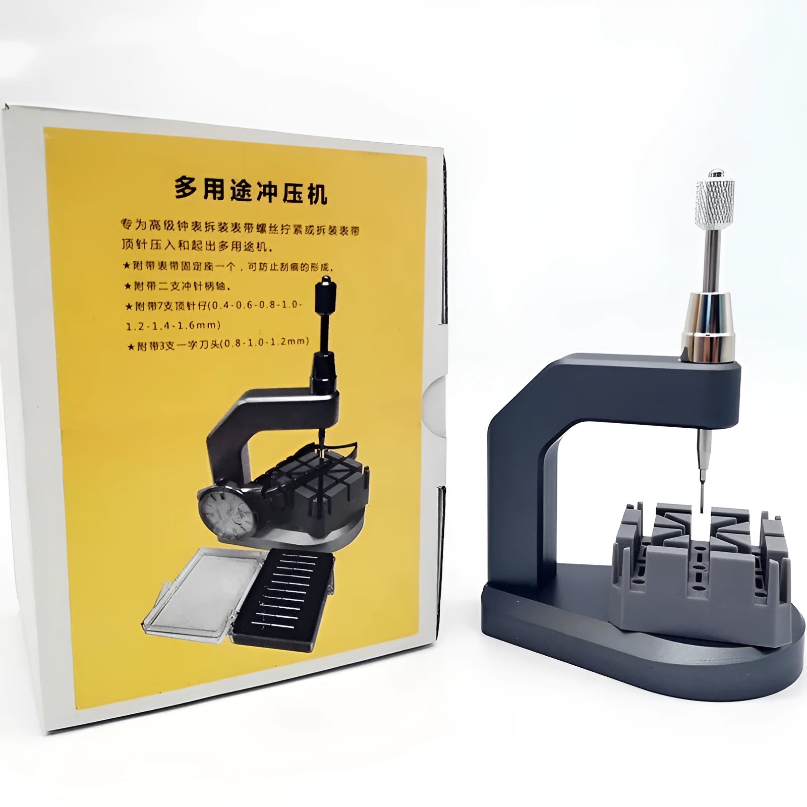 Silver coloured tool steel press strap removal tool for watch and jewellery repair on a dark surface.