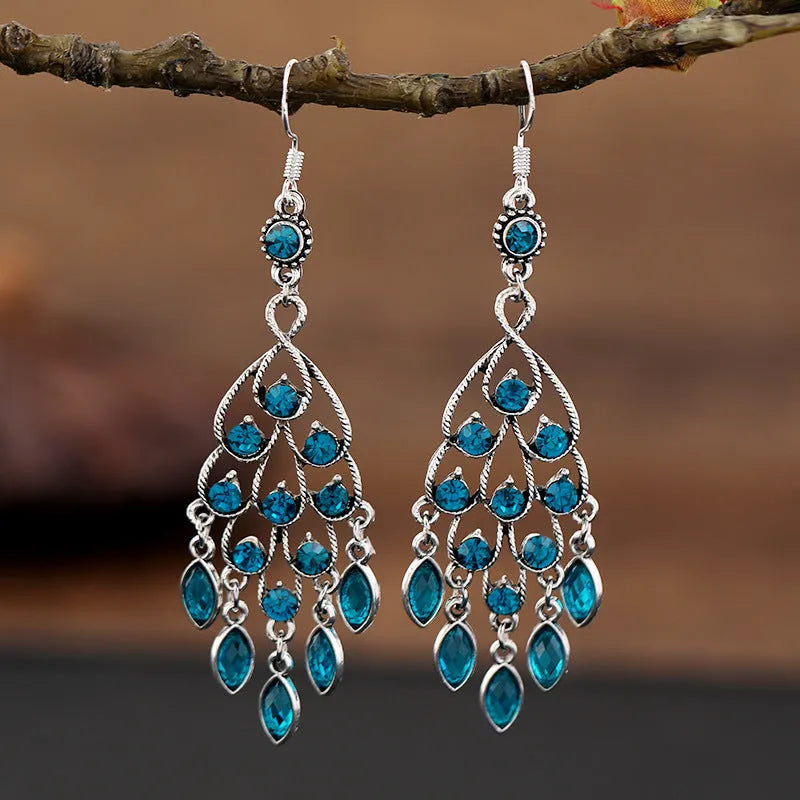 Purple drop shape fringe earrings with retro crystal detailing and ethnic style elements
