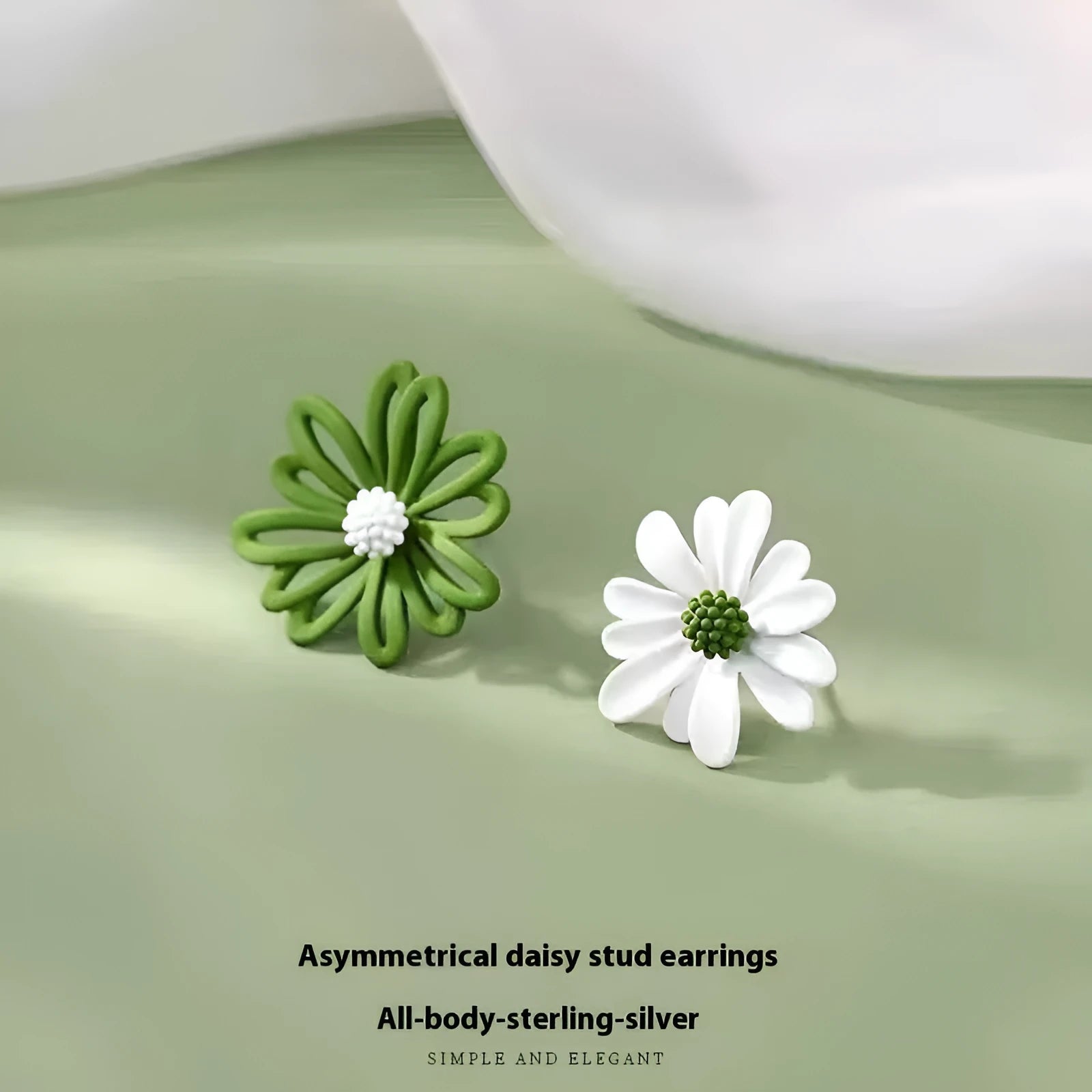 Cartoon style flower stud earrings made from alloy in blue and orange two-tone colours.