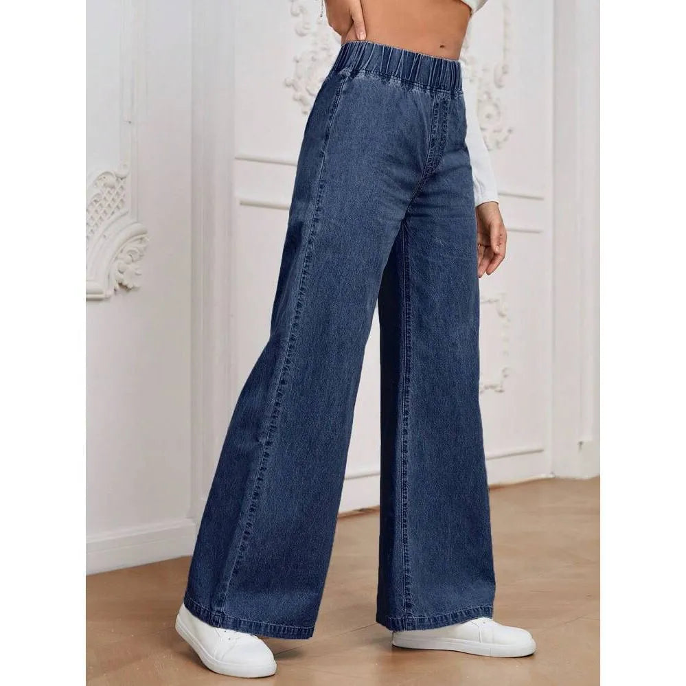 Light blue washed wide-leg denim trousers on a hanger, showing straight cut and zip front.