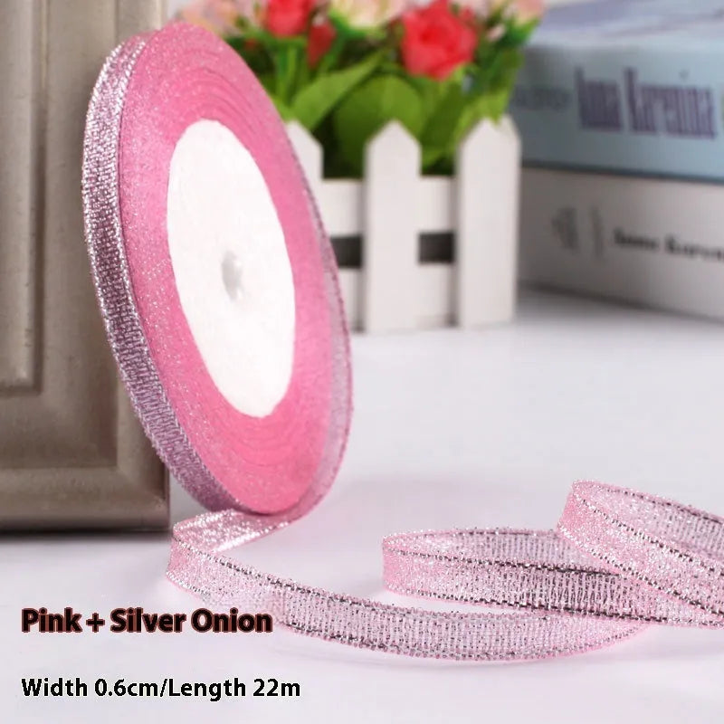Roll of narrow 0.6cm wide polyester gift wrapping ribbon in assorted colours, showing 22 metre length.