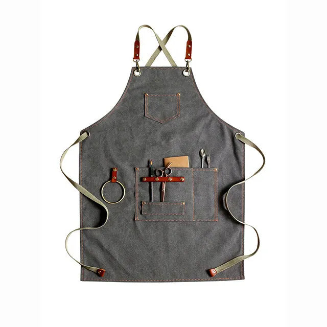 Canvas apron with cross back straps in camel colour for cafe and baking workwear