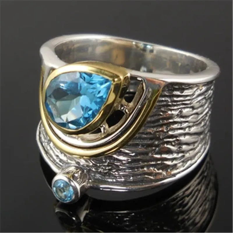 Blue zircon Chinese style drop shape alloy ring with rhinestone detailing on silver-toned band