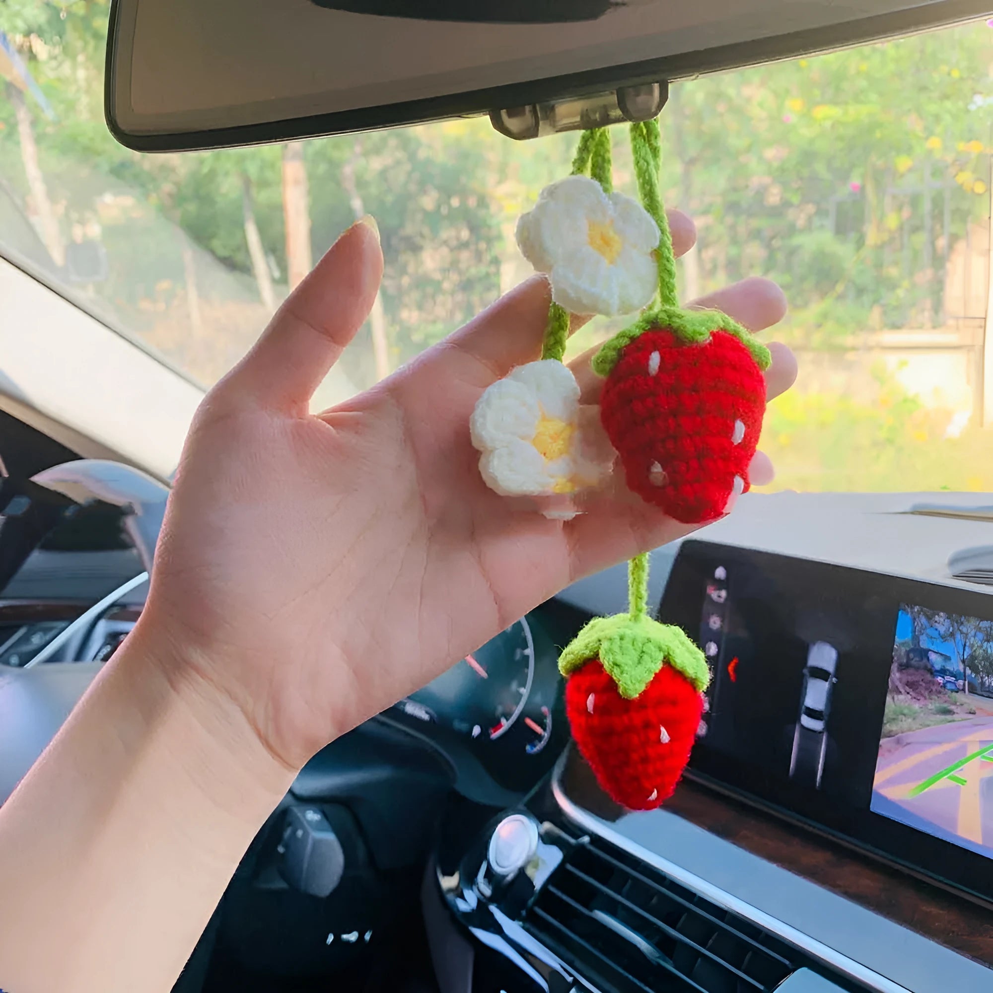 Handmade strawberry-shaped car pendant woven from cotton and hemp with natural colours