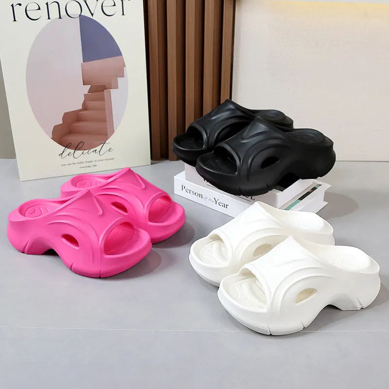 Women's thick-soled beach slippers in white, black, and rose red colours with EVA construction