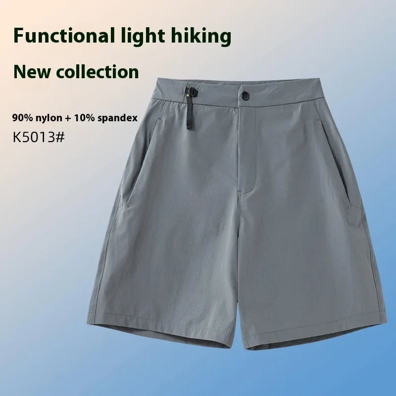 Men's solid colour quick-dry sports shorts with elastic construction for running and climbing.