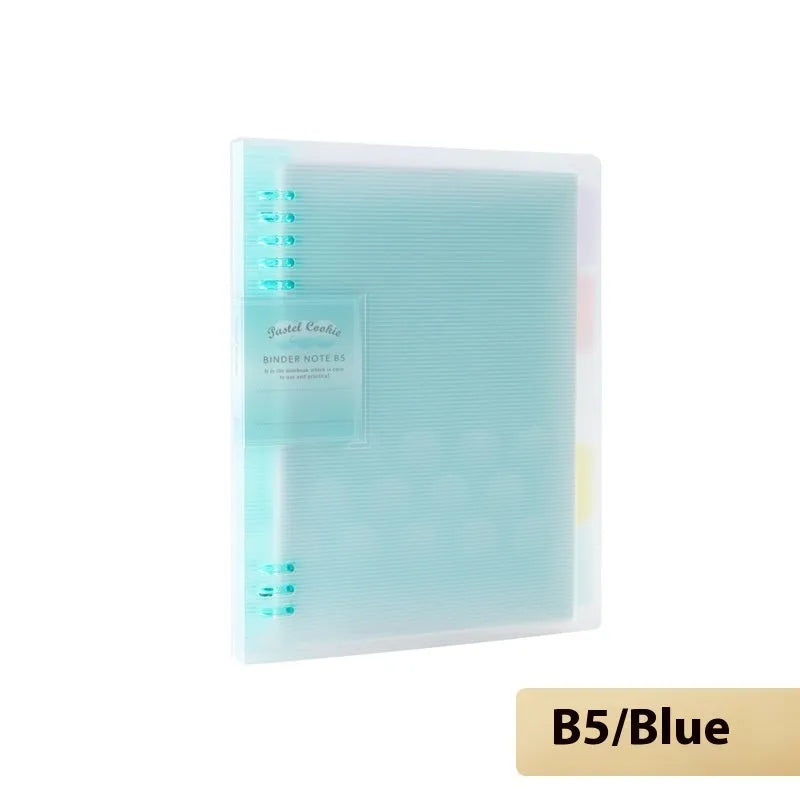 Refillable loose-leaf spiral notebook with PP cover open, showing raw wood pulp paper in grid ruling.