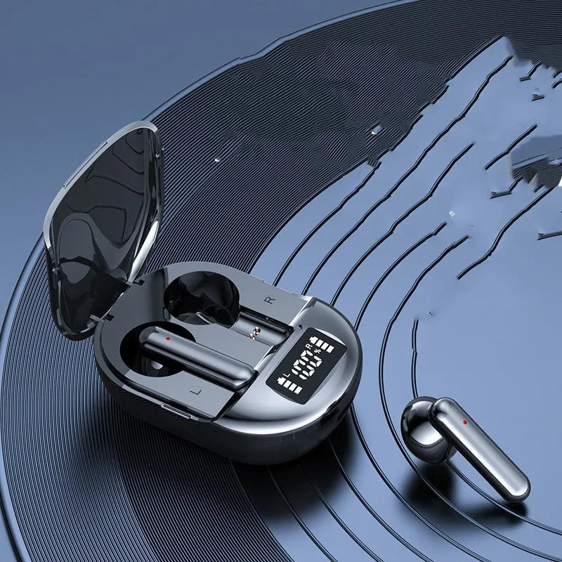 Black and white wireless Bluetooth in-ear headphones with a digital display, shown next to their charging case.