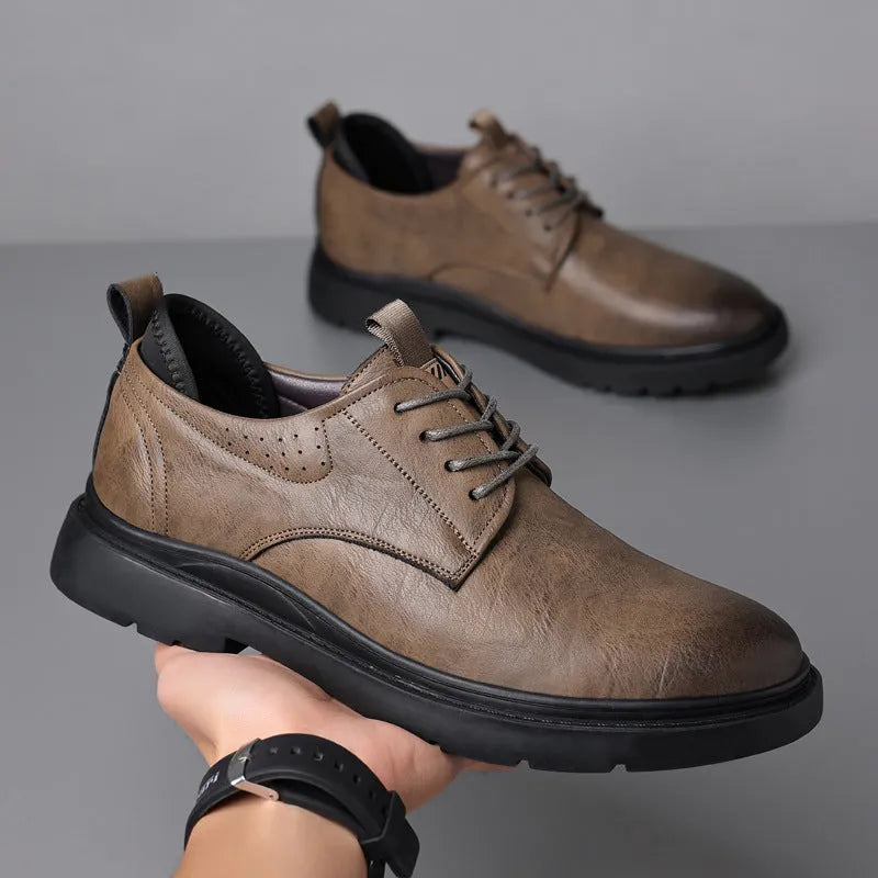 Men's black leather sneakers with decorative sewing lines and rubber sole shown in size 42