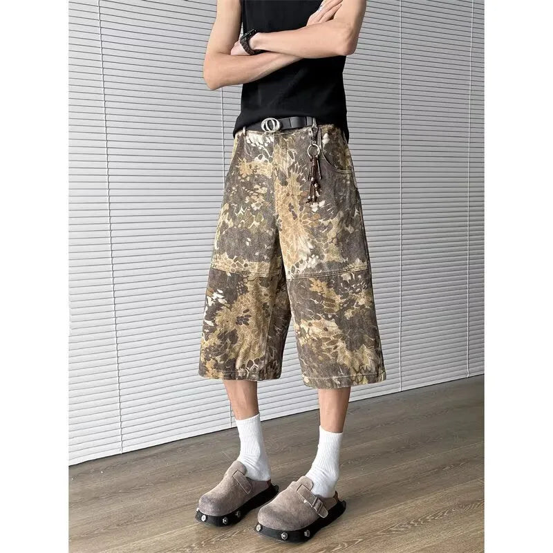 Yellow snake pattern camouflage cropped jeans on hanger showing tooling detail