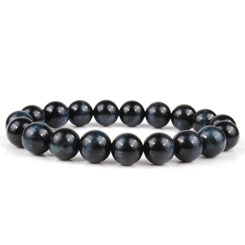Natural tigereye crystal bracelet with geometric round beads showing colour and size options.