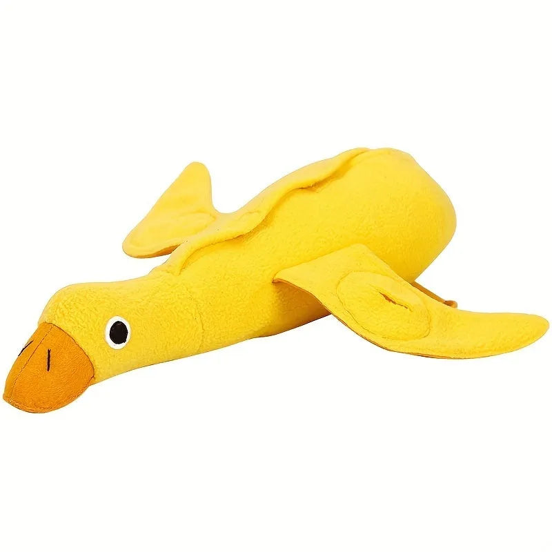 Yellow plush duck dog toy with a sound module and treat-dispensing openings.