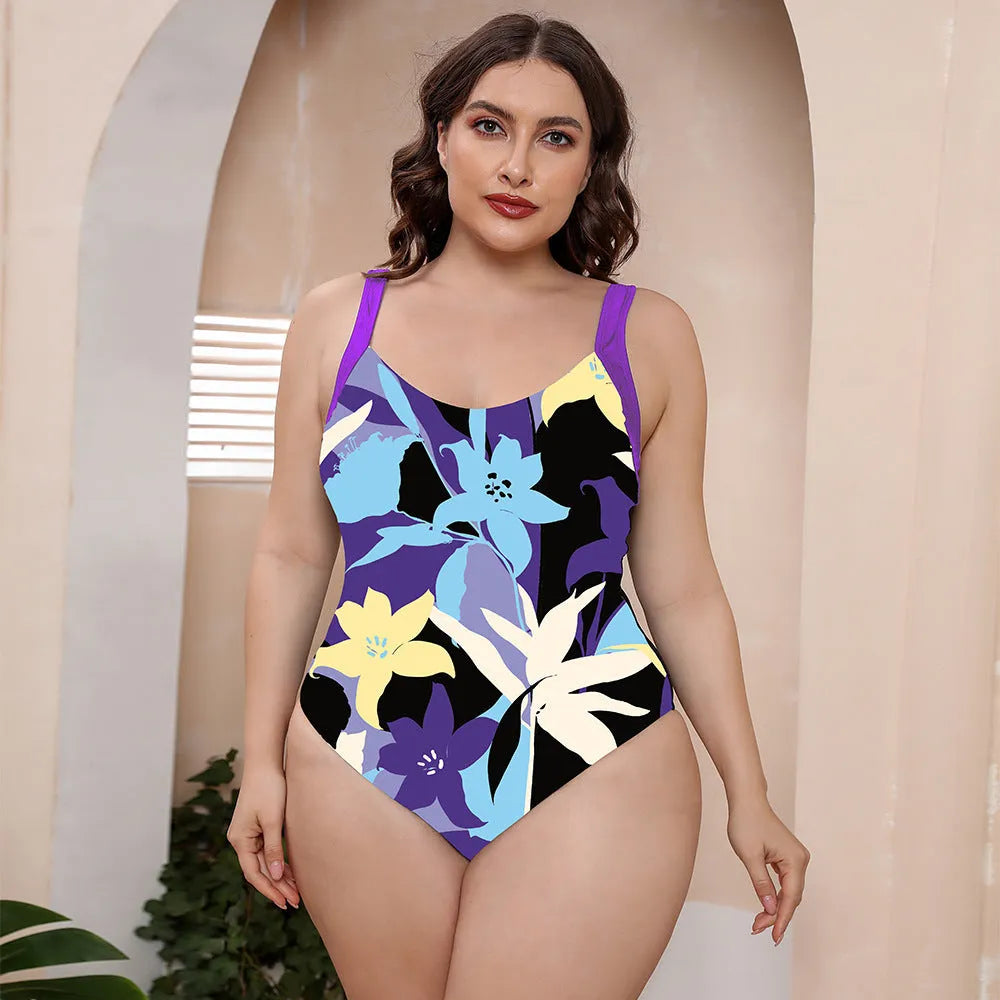 Women's vest style one-piece floral print swimsuit with spaghetti straps on a mannequin.