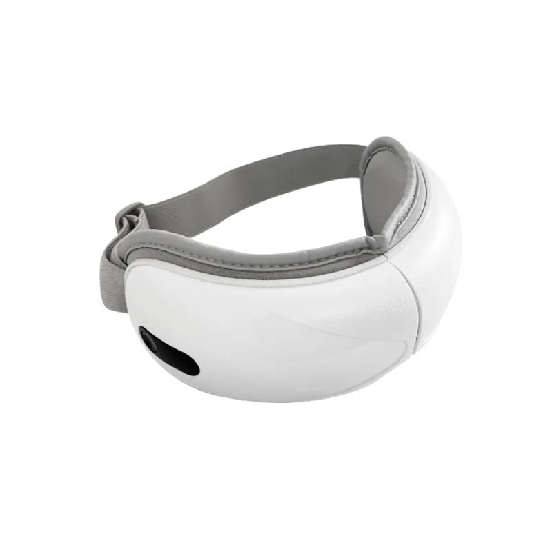 White rechargeable eye massager with airbag massage and hot compress functions on a plain background