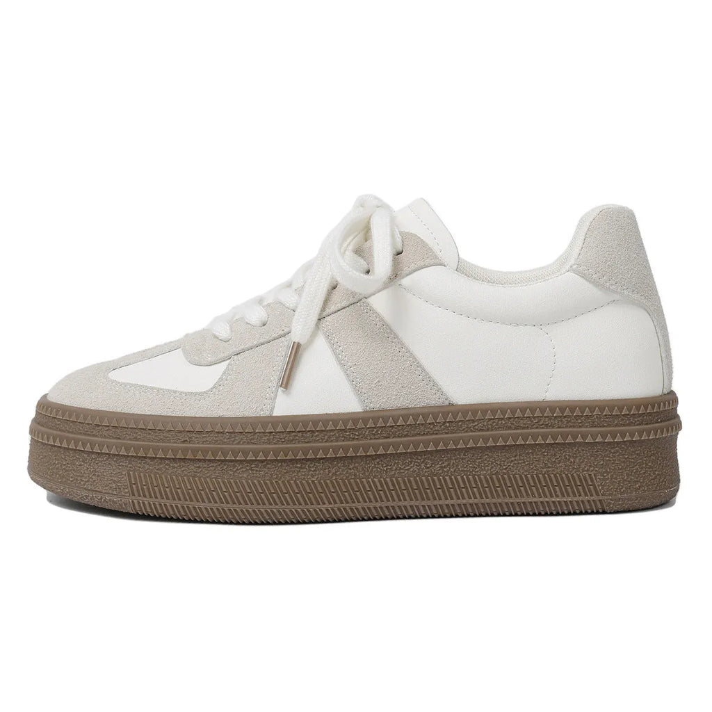 Retro sports shoes with round toe, cross straps, and lace-up front in milky white colour