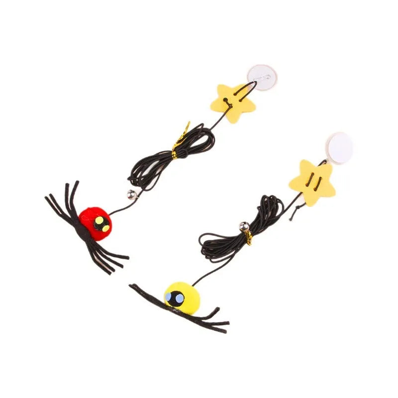 Hanging elastic rope cat toy with feather, bell and spider elements on playing stick in red colour