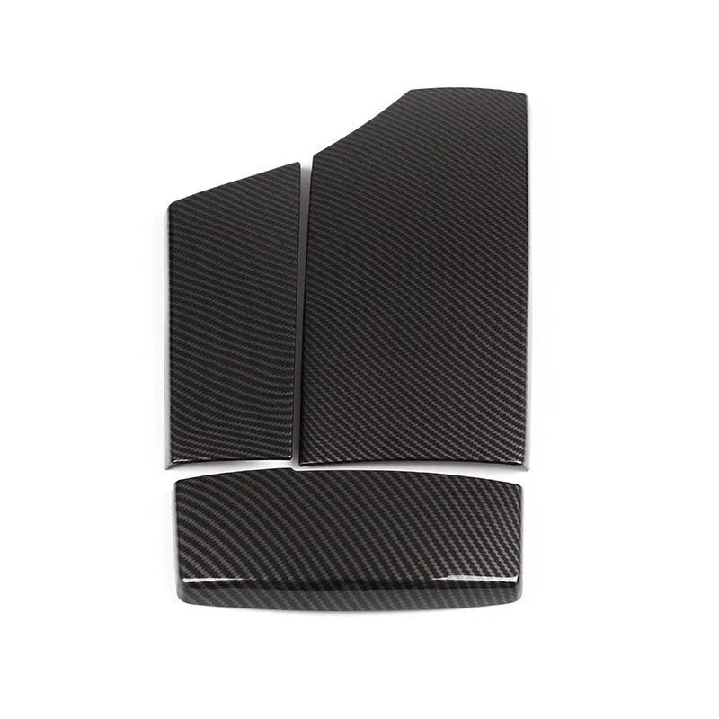 Set of three black ABS protective covers with a carbon fibre weave pattern for car armrest boxes.