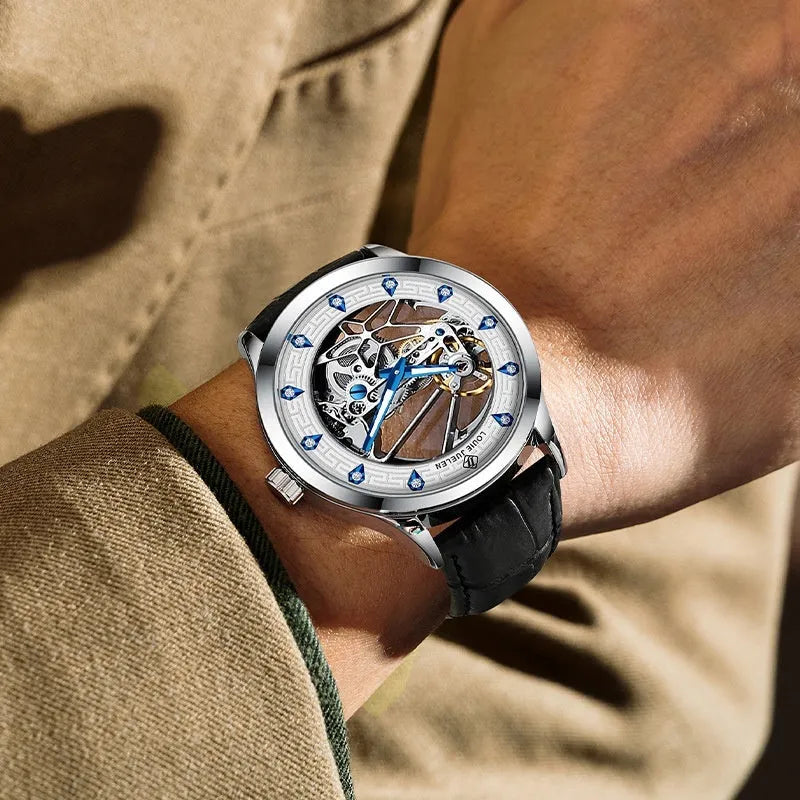 Men's silver mechanical watch with white dial, blue hands, black leather strap, and butterfly clasp.