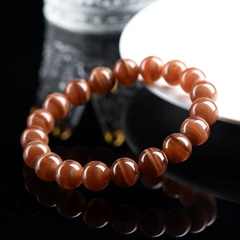 Natural rhodochrosite bracelet with round beads in old mine colour from Peru