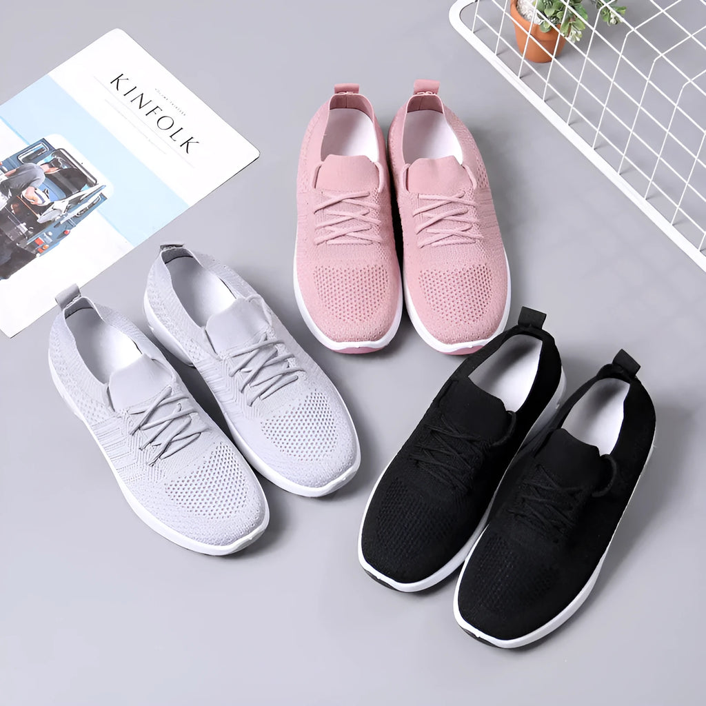 Women's black mesh casual sneakers with lace-up front and a light grey PVC sole.