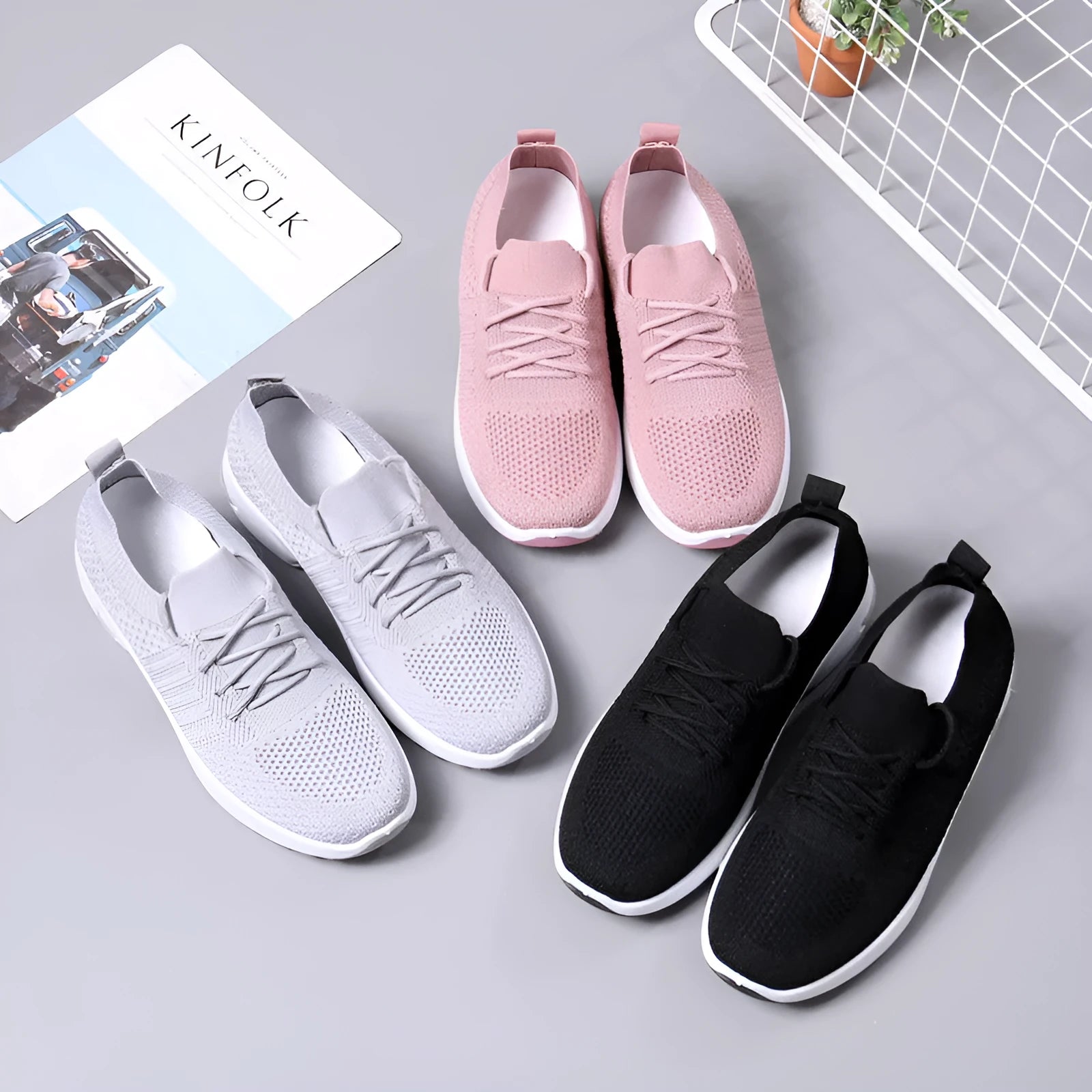 Women's black mesh casual sneakers with lace-up front and a light grey PVC sole.