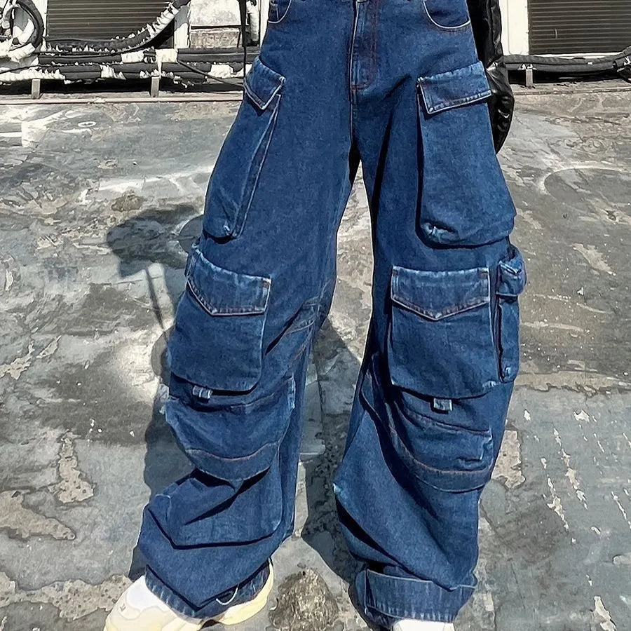 Dark blue distressed wide-leg jeans with a high waist and multiple pockets on a model.