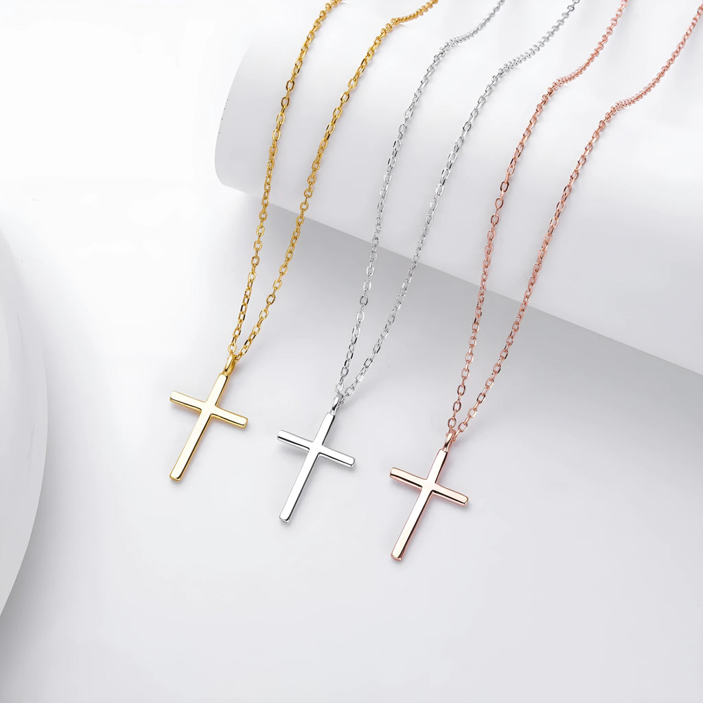 Sterling silver cross pendant necklace on an adjustable O-shaped chain, shown in gold plating.