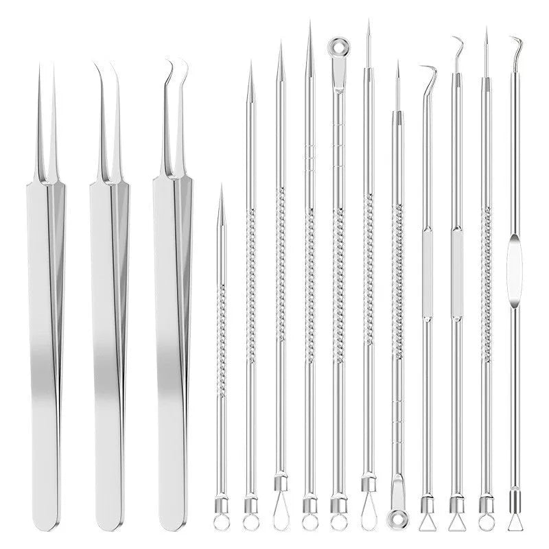 Four metal acne needles with pointed tips arranged on a clean surface.