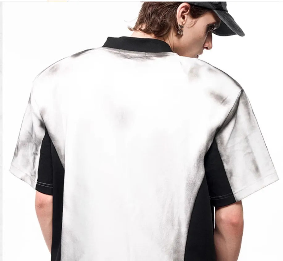 Women's black V-neck short sleeve top with white letter snake pattern print and padded shoulders.