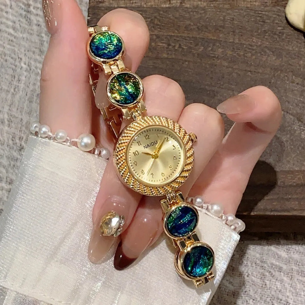 Women's quartz watch with 25mm round dial in one of six colours including milky white and dark green