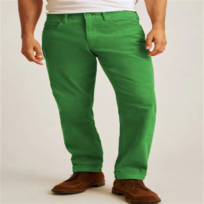 Men's corduroy straight leg trousers in army green showing mid waist and zip fly detail