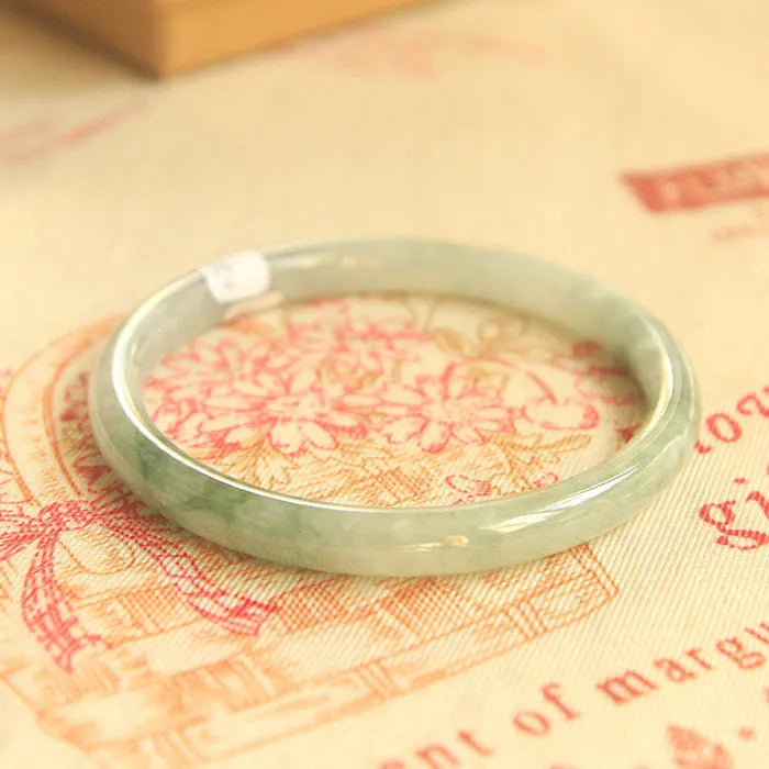 Green jade waxy geometric bracelet with Chinese style design and adjustable sizing