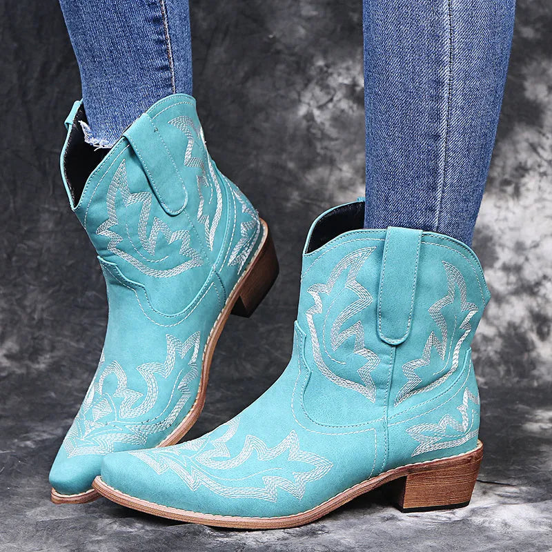 Women's blue embroidered cowboy boots with a wedge heel and pointed toe