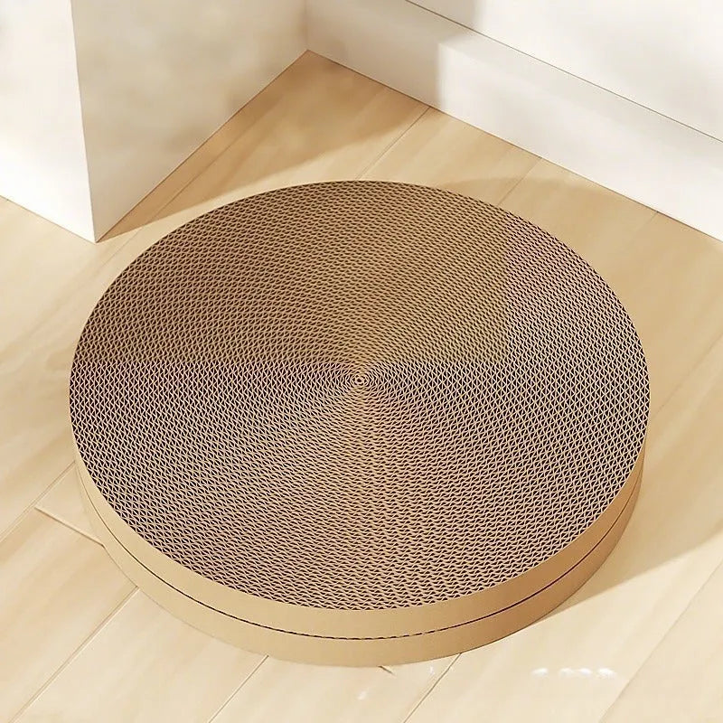 Green round cat scratching board with corrugated paper surface measuring 55 cm diameter