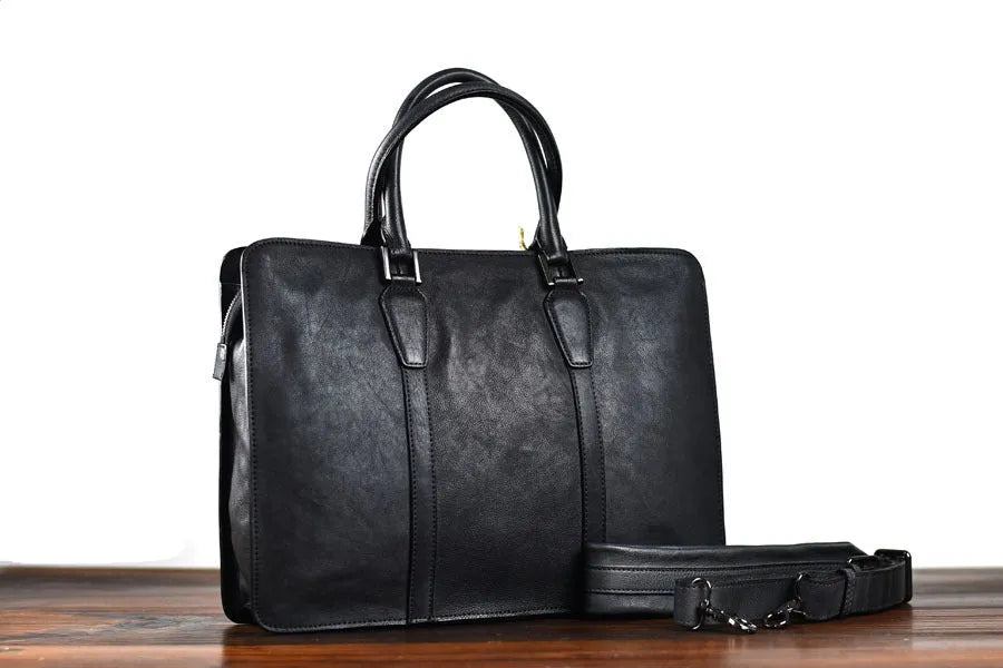 Men's brown leather retro horizontal business handbag with zipper opening.